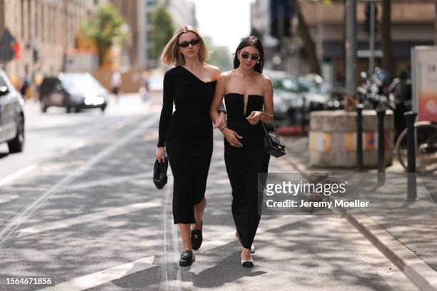 Isabelle Hartmann is seen wearing golden earrings from Yves Saint Laurent, black narrow sunglasses from Saint Laurent, a black one shoulder...