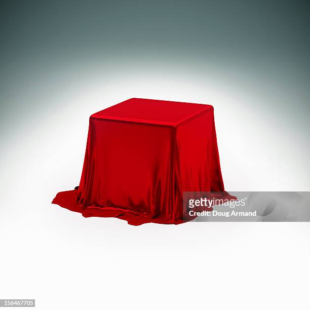 mystery box under red silk cloth - mystery stock illustrations