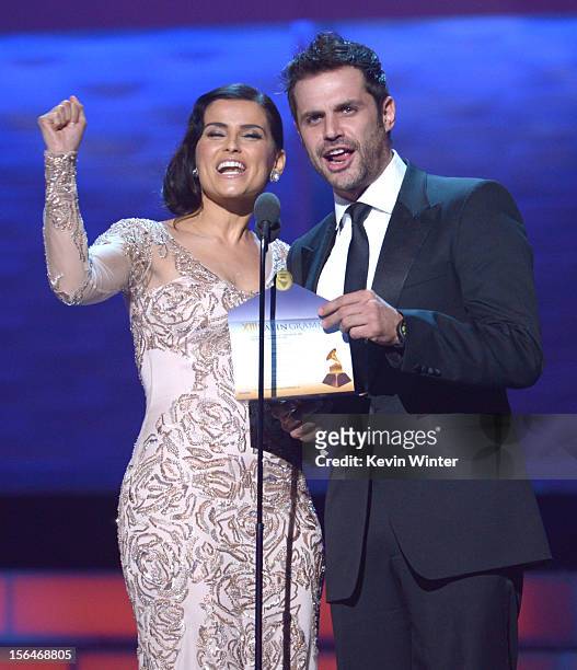 Presenters Nelly Furtado and Mark Tacher speak onstage during the 13th annual Latin GRAMMY Awards held at the Mandalay Bay Events Center on November...