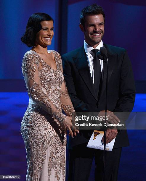 Presenters Nelly Furtado and Mark Tacher speak onstage during the 13th annual Latin GRAMMY Awards held at the Mandalay Bay Events Center on November...