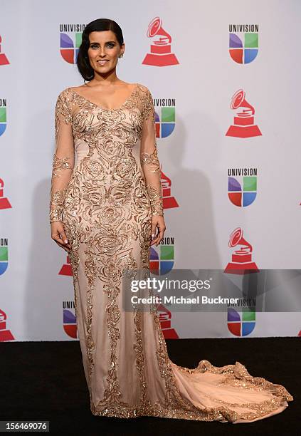 Singer/songwriter Nelly Furtado poses in the press room during the 13th annual Latin GRAMMY Awards held at the Mandalay Bay Events Center on November...