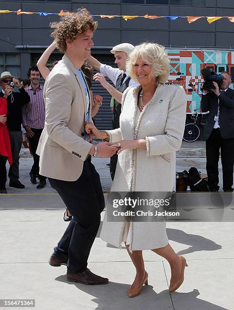 Camilla, Duchess of Cornwall dances with Sam Johnson at the Dance-O-Mat during a visit to Christchurch on November 16, 2012 in Feilding, New Zealand....