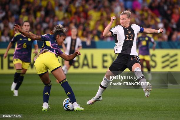 Germany's forward Alexandra Popp fights for the ball with Colombia's midfielder Jorelyn Carabali during the Australia and New Zealand 2023 Women's...