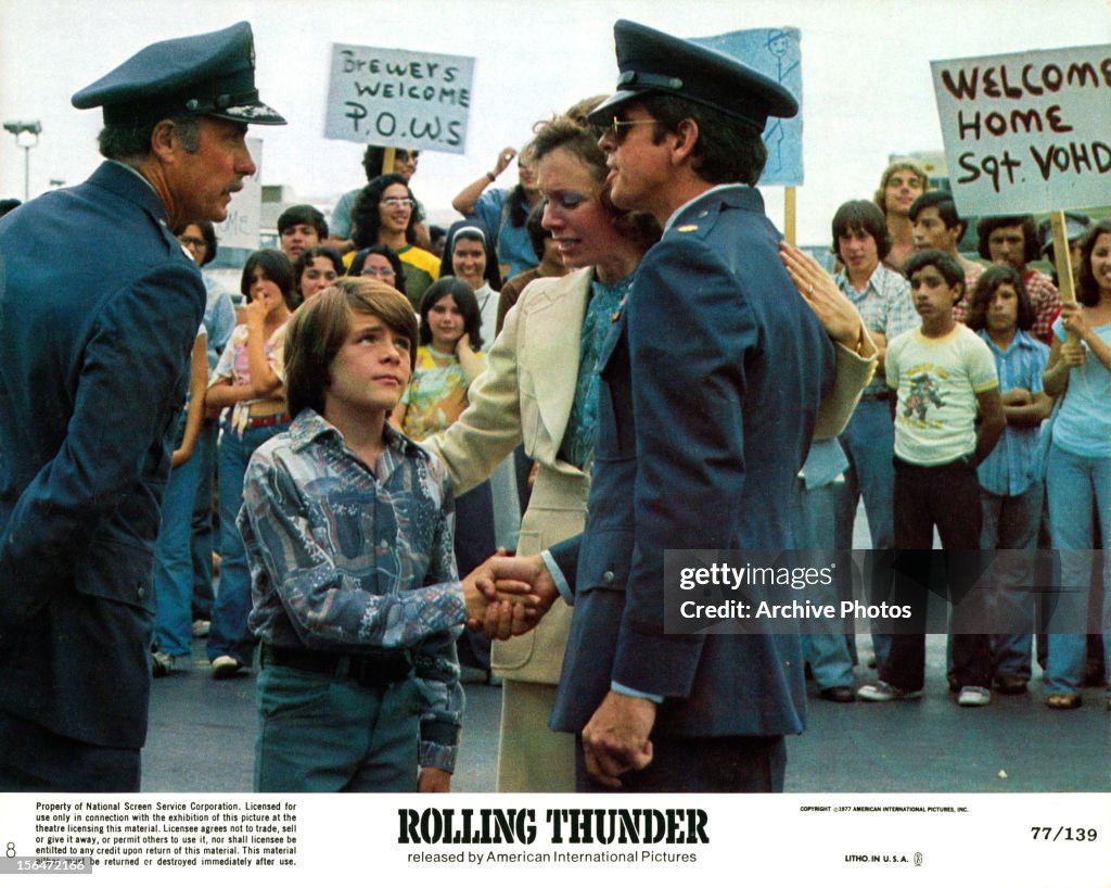 Devane William Devane shakes the hand of a child in a scene from the film ...