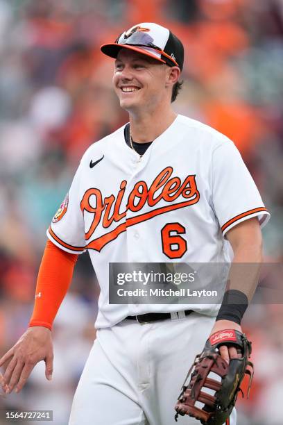 Ryan Mountcastle of the Baltimore Orioles mascot celebrates a win after a baseball game against the Miami Marlins at Oriole Park at Camden Yards on...