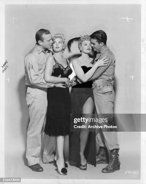 Aldo Ray, Barbara Nichols, Lili St Cyr, and Cliff Robertson embracing each other in publicity portrait for the film 'The Naked And The Dead', 1958.