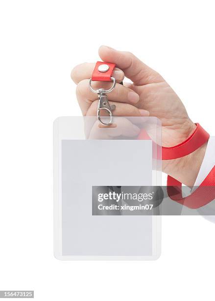 human hand holding name tag - namnskylt bildbanksfoton och bilder