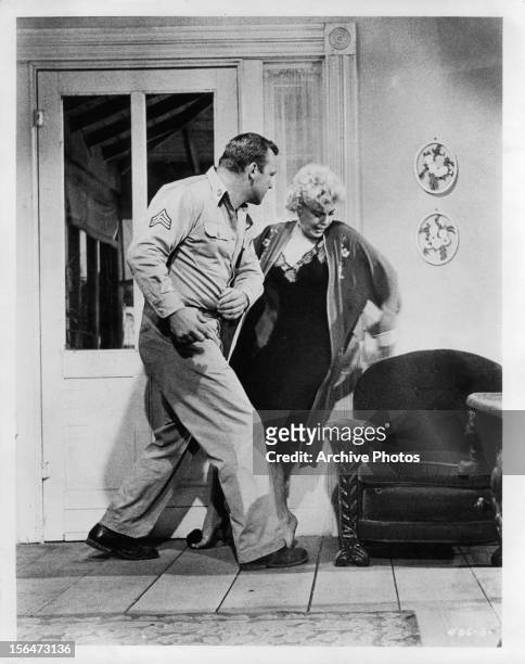 Aldo Ray slaps Barbara Nichols in scene from the film 'The Naked And The Dead', 1958.