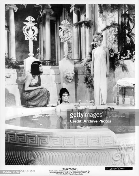 Elizabeth Taylor sitting in bath in a scene from the film 'Cleopatra', 1963.