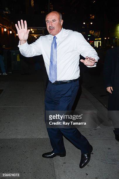 Personality Dr. Phil McGraw enters the "Late Show With David Letterman" taping at the Ed Sullivan Theater on November 15, 2012 in New York City.