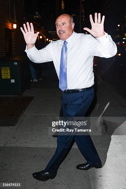 Personality Dr. Phil McGraw enters the "Late Show With David Letterman" taping at the Ed Sullivan Theater on November 15, 2012 in New York City.