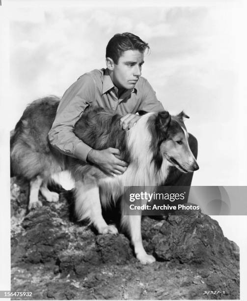 Peter Lawford and Lassie in publicity portrait for the film 'Son Of Lassie', 1945.