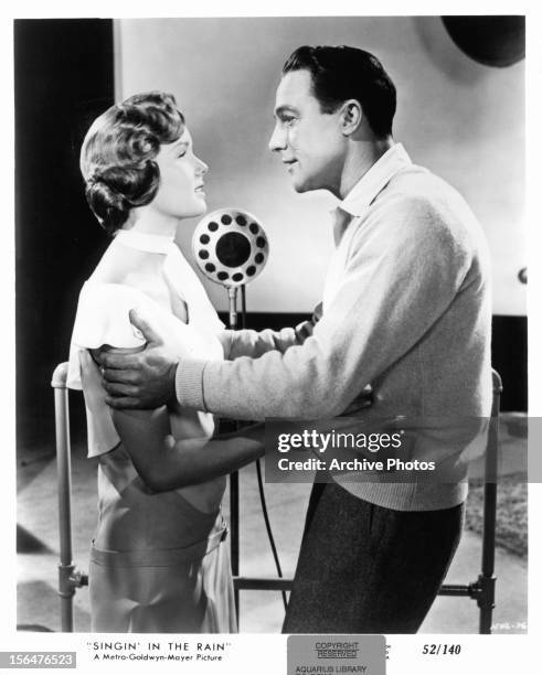 Debbie Reynolds holds Gene Kelly in a scene from the film 'Singin' In The Rain', 1952.