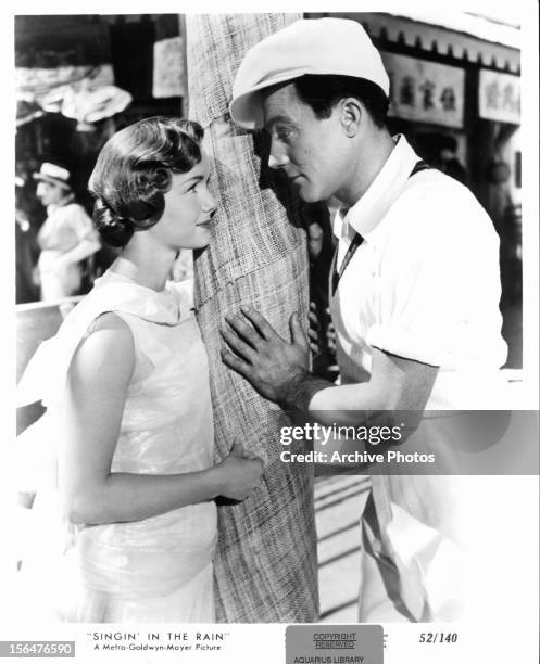 Debbie Reynolds looks at Gene Kelly in a scene from the film 'Singin' In The Rain', 1952.