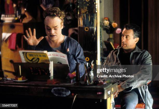 Philip Seymour Hoffman at the piano as Robert De Niro watches in a scene from the film 'Flawless', 1999.