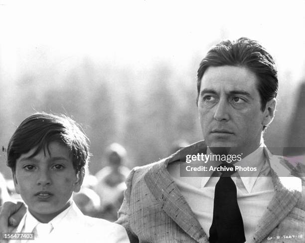 Al Pacino with child in a scene from the film 'The Godfather: Part II', 1974.