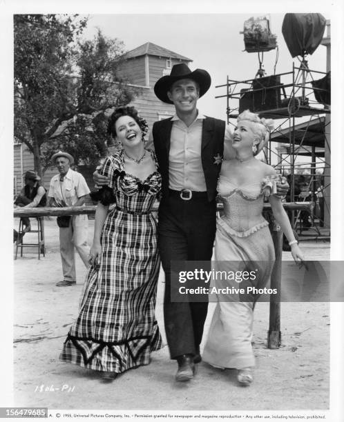 Jane Howard, Jock Mahoney, and Mara Corday pose in publicity portrait for the film 'A Day Of Fury', 1956.