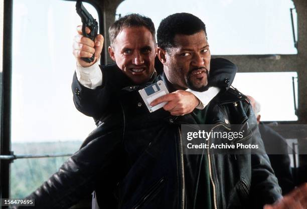Robert John Burke taking Laurence Fishburne hostage in a scene from the film 'Fled', 1996.