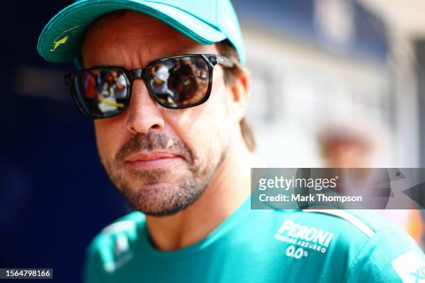 Fernando Alonso of Spain and Aston Martin F1 Team looks on from the drivers parade prior to the F1 Grand Prix of Hungary at Hungaroring on July 23,...