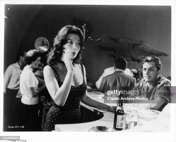 Juliette Gréco at bar in a scene from the film 'The Roots Of Heaven', 1958.