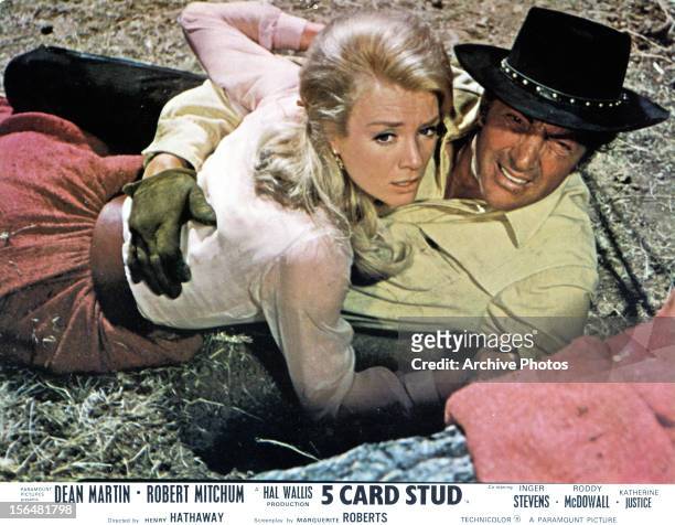 Inger Stevens is held by Dean Martin in a scene from the film '5 Card Stud', 1968.