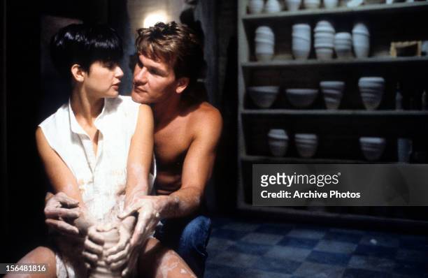 Demi Moore is embraced by Patrick Swayze in a scene from the film 'Ghost', 1990.