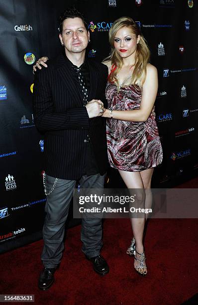 Director Rob Hall and actress Angelina Armani arrive for sCare Foundation's 2nd Annual Halloween Benefit held at The Conga Room at L.A. Live on...