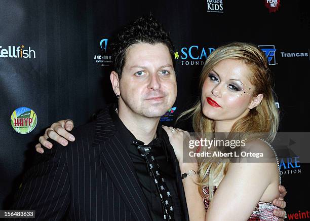 Director Rob Hall and actress Angelina Armani arrive for sCare Foundation's 2nd Annual Halloween Benefit held at The Conga Room at L.A. Live on...