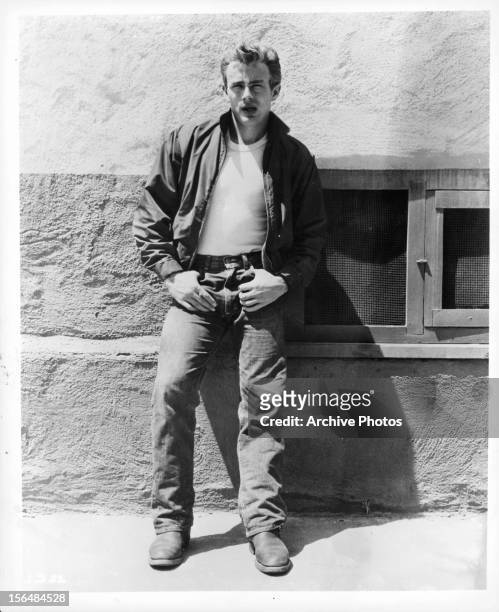 James Dean stands on a wall in a scene from the film 'Rebel Without A Cause', 1955.