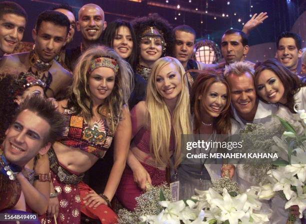 Swedish singer Charlotte Nilsson and her band pose for photographers after winning the 44th Eurovision song contest held at the International...