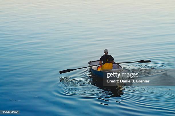 fisherman rowing a skiff in buck's harbor, maine - 手漕ぎ船 ストックフォトと画像