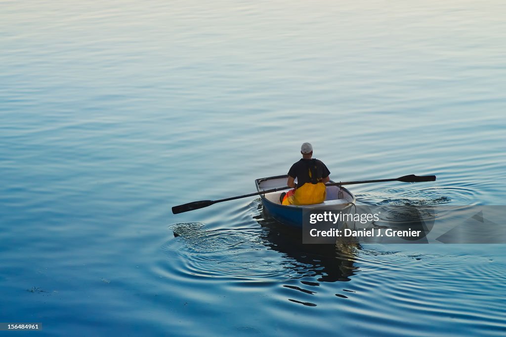 Fisherman rowing a skiff in Buck's Harbor, Maine