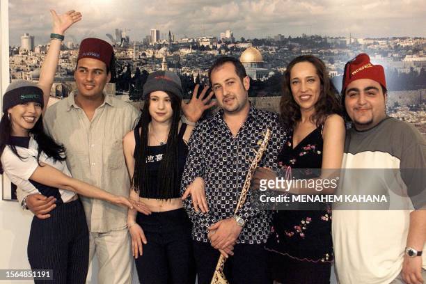 German-Turkish ethno pop group, Surpriz, Germany's entry to the 1999 Eurovision song contest, pose for photographers in Jerusalem in front of a...