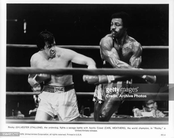 Sylvester Stallone boxes Carl Weathers in a scene from the film 'Rocky', 1976.