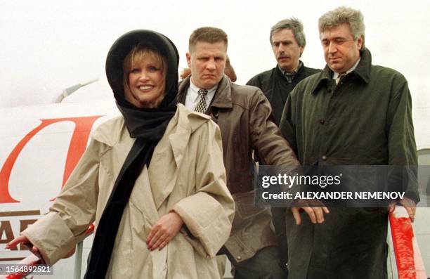 Famous Russian singer Alla Pugacheva followed by Krasnoyarsk governor Valery Zubov arrives at the Krasnoyarsk airport, 14 May. Alla Pugacheva arrived...