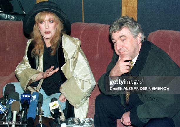 Famous Russian singer Alla Pugacheva speaks to the press after arrival in Krasnoyarsk airport as the governor Valery Zubov listens, 14 May. Alla...