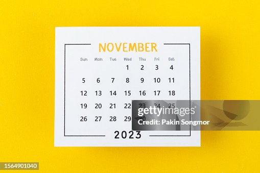 Calendar Desk 2023: November is the month for the organizer to plan and deadline with a yellow paper background.