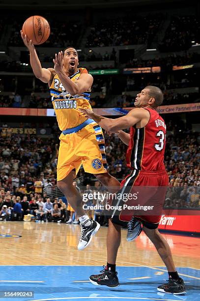 Andre Miller of the Denver Nuggets takes a shot against Shane Battier of the Miami Heat at the Pepsi Center on November 15, 2012 in Denver, Colorado....