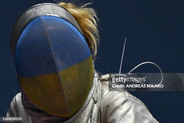 Ukraine's Olha Kharlan reacts as she competes against South Korea's Yoon Ji-su during the Women's Team Sabre event's Bronze medal match, as part of...