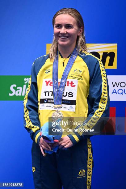 Gold medallist Ariarne Titmus of Team Australia poses during the medal ceremony for the Women's 400m Freestyle Final after winning with a new world...