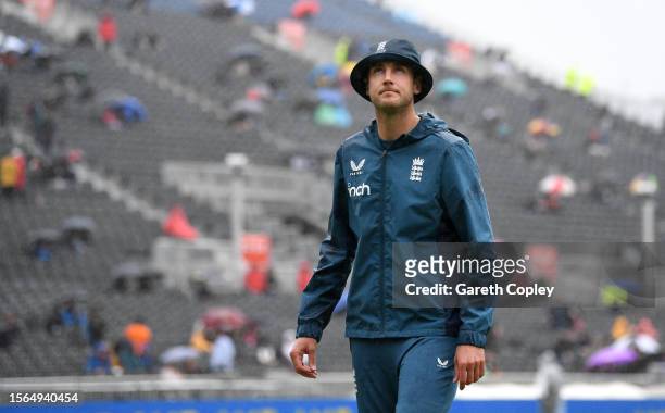 Stuart Broad of England walks from the field as hewait for the rain to stop as it delays the start of day five on the LV= Insurance Ashes 4th Test...