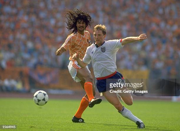 Gary Stevens of England goes past Ruud Gullit of Holland during the European Championship Group 2 match at the Rheinstadion in Dusseldorf, West...
