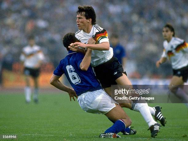 Lothar Matthaus of West Germany is blocked by Ricardo Ferri of Italy during the European Championship Group 1 match at the Rheinstadion in...