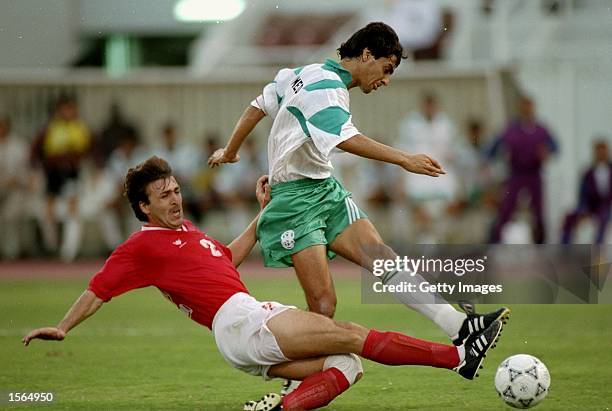 Ahmad Radhi Amish of Iraq takes on Javad Zarinecheh of Iran during a World Cup qualifying match in Doha, Qatar. Iraq won the match 2-1. \ Mandatory...