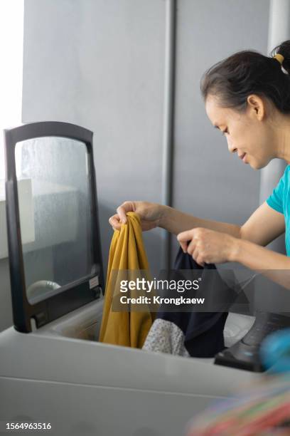 laundry made easy - easy load stock pictures, royalty-free photos & images
