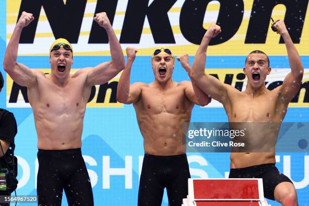 Jack Cartwright, Kai Taylor of Australia and Flynn Southam of Team Australia celebrates winning gold in the Men's 4 x 100m Freestyle Relay Final on...