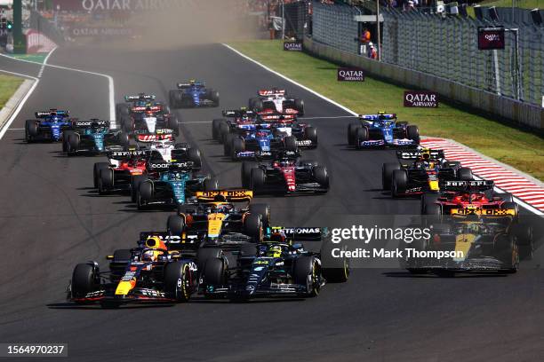 Max Verstappen of the Netherlands driving the Oracle Red Bull Racing RB19 leads Lewis Hamilton of Great Britain driving the Mercedes AMG Petronas F1...