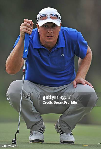 Fredrik Andersson Hed of Sweden lines up a putt during the second round of the UBS Hong Kong open at The Hong Kong Golf Club on November 16, 2012 in...