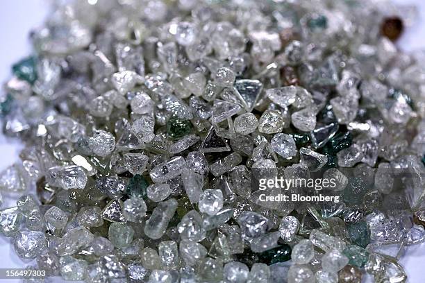 Pile of colorless and colored uncut diamonds sit on a sorting table during processing at DTC Botswana, a unit of De Beers, in Gaborone, Botswana, on...