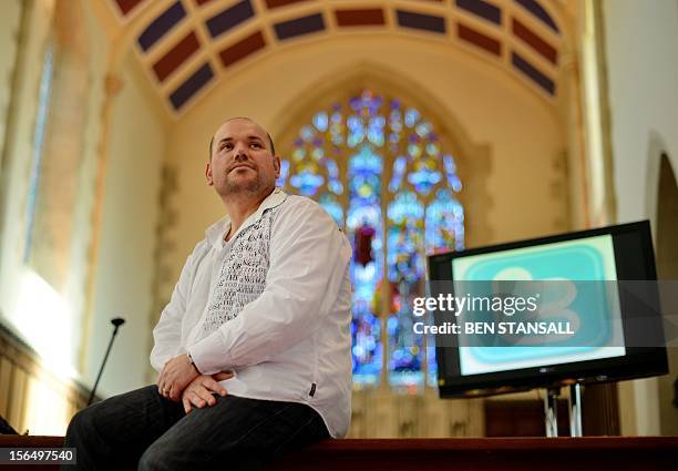 Children’s Church and Youth Pastor Brian Champness poses for pictures following his church service where the congregation were invited to use Twitter...